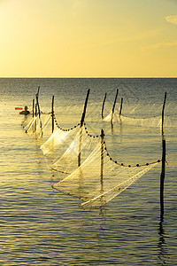 泰国湾渔网捕鱼颜色时间天际日落钓鱼支撑海滨太阳滨湖阴影图片