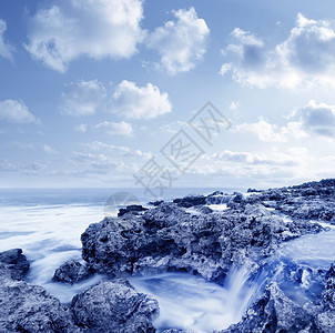 A 使用海中海洋的反射季节风暴天空假期蓝色场景支撑海浪日落图片