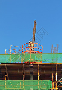 与工人一起在建建筑中的建筑背景图片