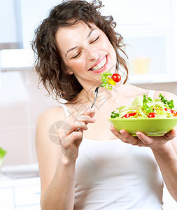 美丽的吃蔬菜的女青年食用蔬菜沙拉食物甜点女士重量损失早餐女孩午餐身体营养图片