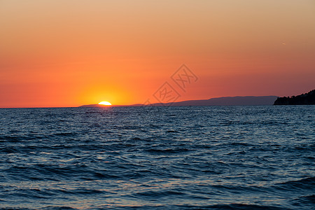 日落在海面上火鸡孤独金子海岸天际反射天堂海湾天空地平线图片