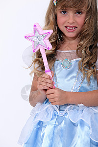 一个穿童话装的小女孩肖像微笑丝绸蓝色裙子长发打扮乐趣派对孩子青年图片