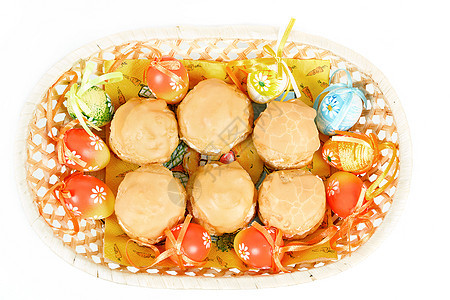 东边鸡蛋和篮子里自制的甜蛋糕装饰假期丝带团体糖果庆典面包焦糖节日传统图片