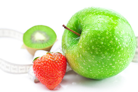 甘草莓 加水滴的苹果 基维和测量磁带等离子体奇异果生活训练健身房水果药品乐器食物卫生摄影图片