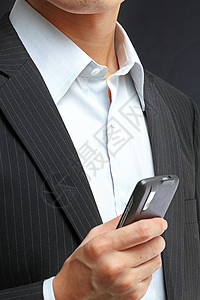 从事黑西装或智能手机工作的人男人细胞手指套装电子邮件电脑键盘商业电话职业图片