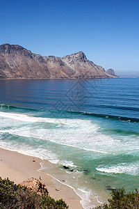 沿非洲南部海岸线的海滩悬崖冲浪晴天支撑假期风景海景海浪海洋场景图片