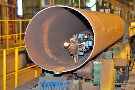 制造钢管的工业机械机机器喷射引擎金属管道自动化工厂力量加工安装图片