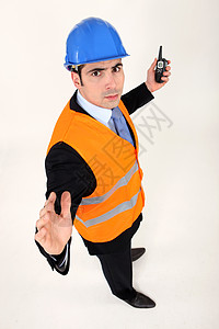 有对讲机的前锋生气建设说话帽子白色商务工人定位建筑师商业图片