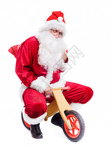 快乐的圣诞老人骑自行车的照片图片