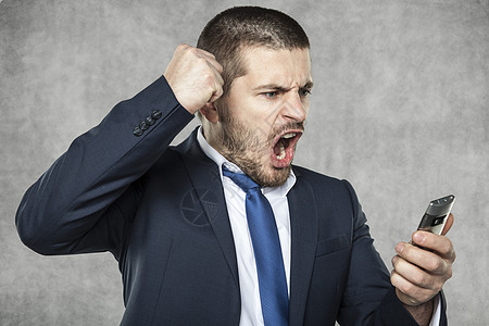愤怒商务人士细胞成人老板危机商业手机工作人士语音技术图片