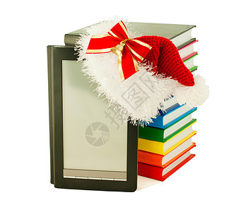 电子图书阅读器 戴着圣诞老人的帽子 并藏书教育展示图书学习小说圣诞礼物读者数字化电子文学图片