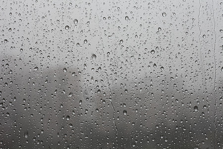 窗口上的雨绿色气象天气悲伤预报玻璃溪流气旋城市图片