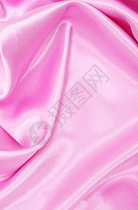 平滑优雅的粉色丝绸婚礼投标材料海浪曲线织物薰衣草布料纺织品背景图片