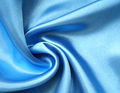 平滑优雅的蓝色丝绸作为背景织物纺织品投标材料奢华海浪艺术感性布料折痕图片
