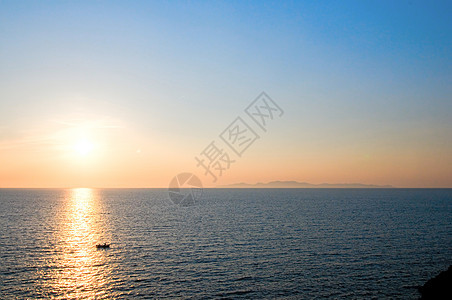 桑托里尼日落海岸假期旅行晴天反射游客橙子季节旅游天气图片