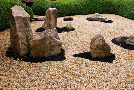 Zen花园卵石巨石生活倾斜圆圈岩石精神冥想专注石头图片