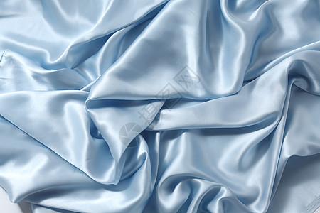 蓝色丝绸背景床单折叠衣服海浪寝具曲线天鹅绒投标纺织品柔软度图片