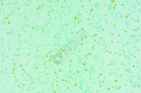 绿色黄色背景的闪亮泡泡背景图片
