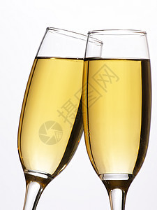 两杯香槟酒加烤面包饮料派对金子玻璃庆典白色气泡长笛液体起泡图片