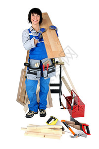 女商务人士冒着工具和建筑用品的外衣工作台维修木材技术员劳动木工承包商腰带零售商蓝色图片