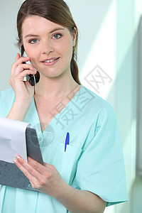 护士打来电话诊所女士职员外科成员微笑医院手术笔记注册图片