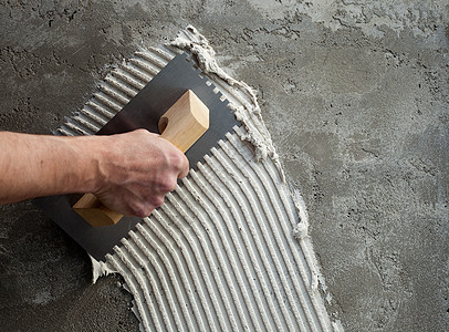 拼装地板白色水泥的未加建造的粗工作粮食工人石匠砂浆瓷砖男人建筑学地面瓦工背景