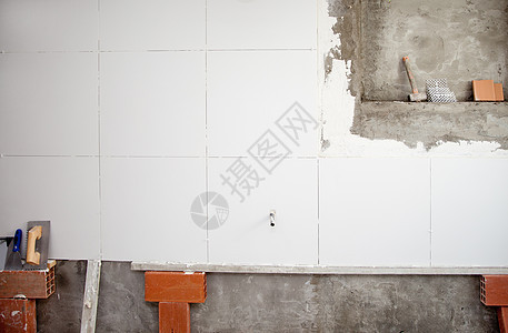 白壁对流与粗体工具男人瓷砖砖墙瓦工石匠石头拼装建造工作建筑学图片