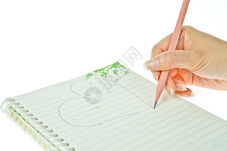 笔和笔记本与心脏隔离在白色背景上图片