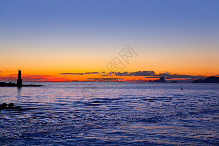 来自福门捷拉萨维纳灯塔的日落灯塔地标旅行建筑蓝色涟漪海滩天空假期大灯图片