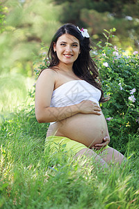 怀孕妇女福利父母诞生母性母亲快乐女士成人微笑花朵图片