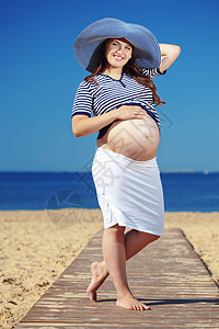 怀孕妇女母亲微笑女性母性帽子冒充诞生快乐女孩假期图片
