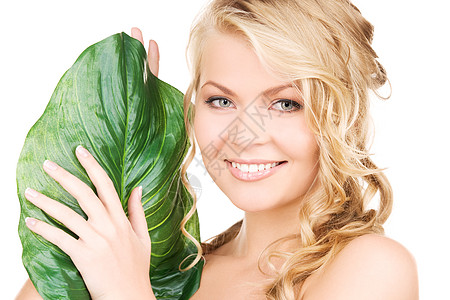 有绿叶的女子皮肤女孩女性微笑植物福利温泉叶子生态平衡图片