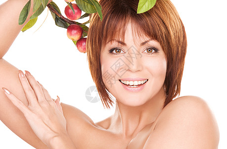有苹果树枝的快乐女人福利女性黑发枝条活力皮肤老化保健中年叶子图片