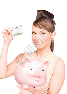 可爱的有小猪银行和钱的女人现金女性快乐财政幸福投资经济女孩小猪黑发图片