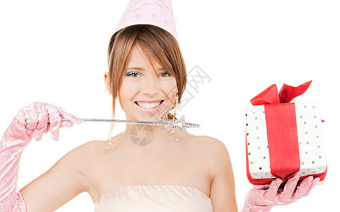 配有魔杖和礼品盒的少女幸福女孩假期棍棒微笑庆典魔法帽子乐趣派对图片