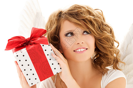带礼物的天使微笑卷曲展示假期盒子福利幸福女性天堂快乐图片
