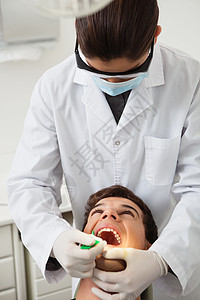 接受牙齿检查的病人乐器女孩助手女性女士治疗牙医诊所工作男性图片