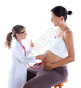美丽的怀孕孕妇和作为听诊医生的女婴女性身体孩子们女士检查福利怀孕者肚子手势幸福图片