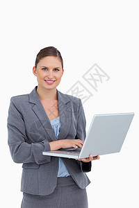 手持笔记本电脑的微笑女商务人士技术套装互联网经理工作售货员公司工人女士管理人员图片