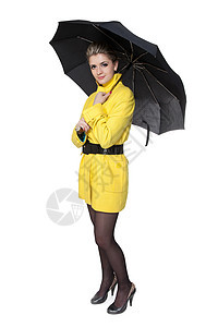 穿黄色大衣 鞋子和雨伞的妇女女孩魅力工作室外套天气季节乐趣夹克剪裁女士图片