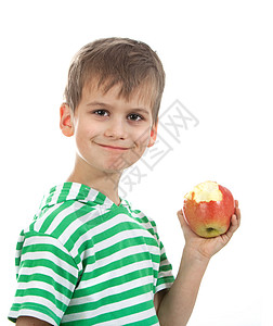 吃元宵男孩拿着苹果头发牙齿微笑眼睛幸福享受水果青年小吃食物背景