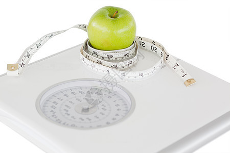 绿苹果圆圈 带磁带量和称号乐器测量甜点水果宏观厘米保健减肥饮食尺寸图片