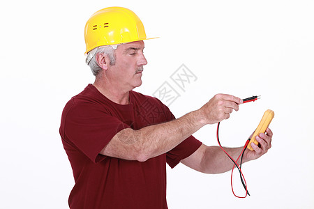 使用多米的电机测量头盔技术压力力量电工技术员修理工电阻器男人图片