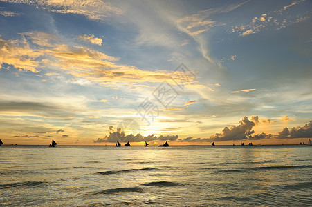 美丽的日落热带海景假期阳光边缘地平线海浪海岸线太阳海洋图片