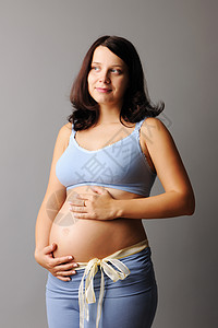 怀孕妇女手臂母性腹部分娩生活婴儿母亲微笑肚子工作室图片