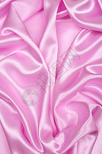 平滑优雅的粉色丝绸作为背景纺织品材料投标布料薰衣草曲线织物海浪婚礼紫丁香背景图片