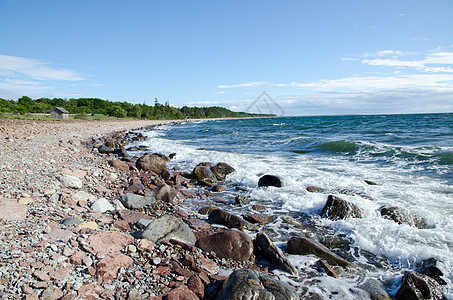 落岩海岸线孤独泡沫海浪海岸蓝色运动晴天风暴石头海洋图片