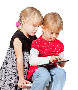 女孩用平板电脑玩药片技术互联网童年孩子软垫学习闲暇视频金发女郎图片