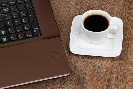 配有膝上型电脑的埃斯法咖啡上网咖啡钥匙键盘工作相框框架金融笔记技术图片