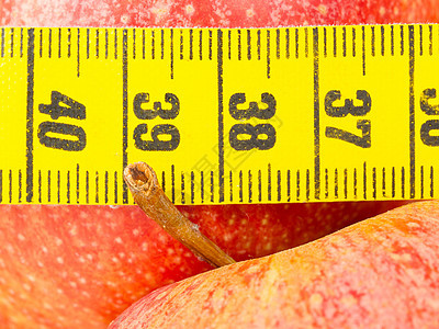 红色苹果和黄色磁带测量法减肥数字损失水果厘米活力营养小吃重量饮食图片